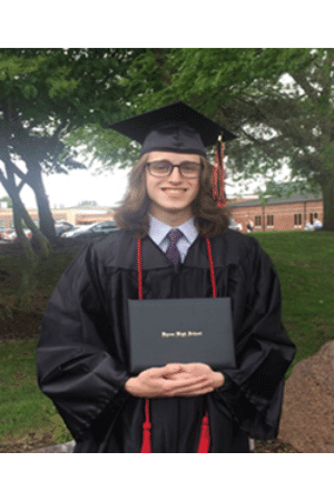 Picture of Daniel Edwards in graduation cap and gown, holding Byron High School diploma.