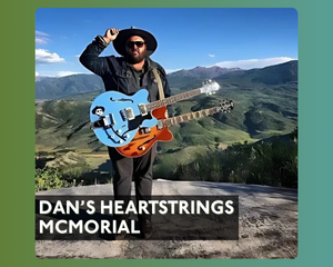 Photo of Dan McMahon with his guitars