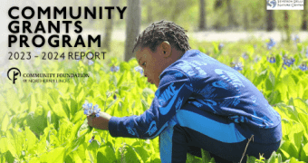 Picture of young boy picking blue flowers. Community Grants Program 2023 - 2024 Report