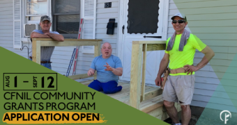 Picture of two men in construction apparel standing next to a newly-constructed wheelchair ramp. Man in blue shirt and pants sits on the wheelchair ramp. Text reads: August 1 - September 12, CFNIL Community Grants Program Application Open
